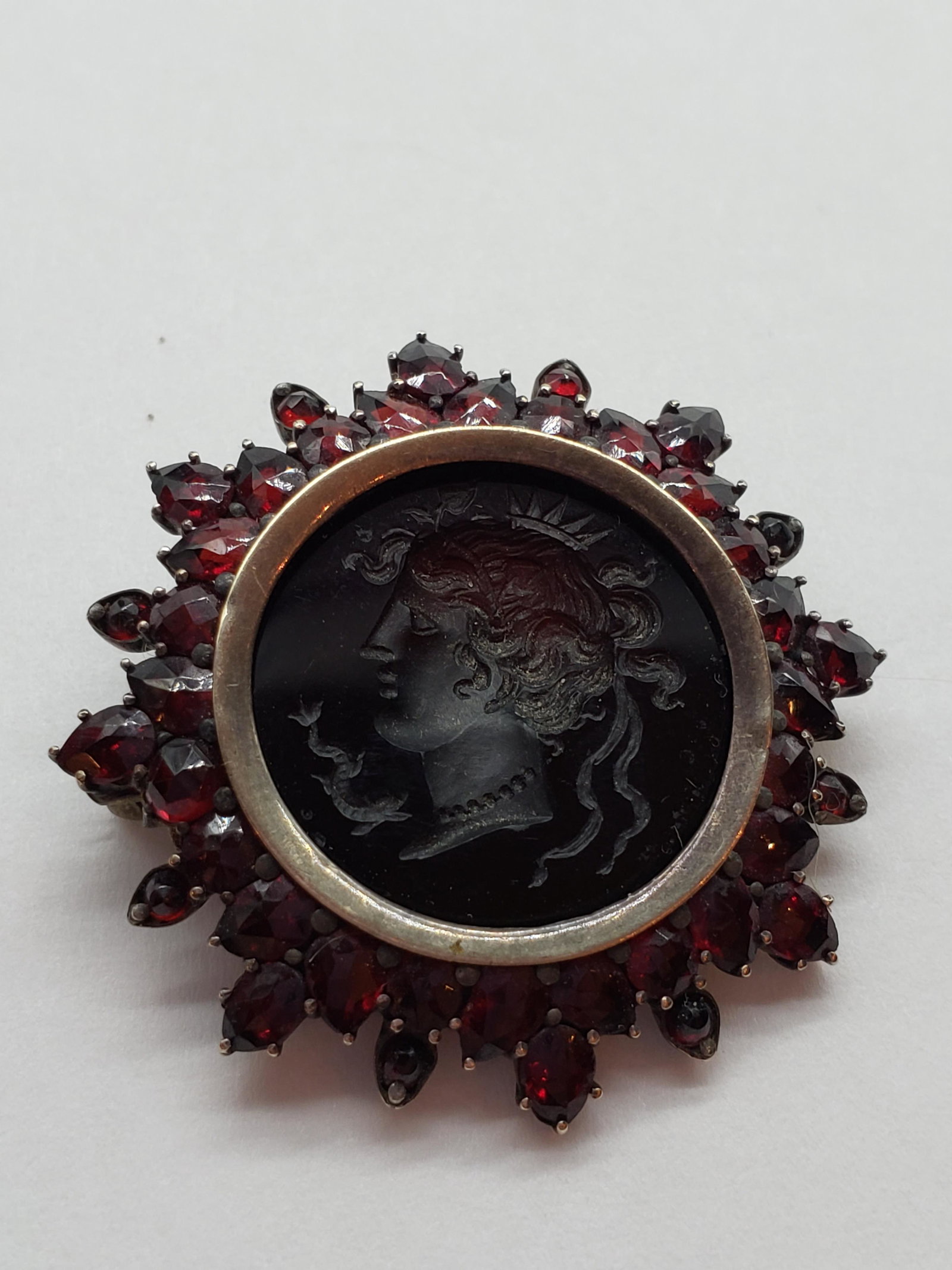HAND CARVED GARNET CAMEO PIN: Hand Carved Garnet Cameo Pin Piece is 1 1/4" Weight is 8.45 Grams All items Located in in Hollywood Florida Warehouse For Shipping Call today for quote they have item numbers and Pak Mail is available