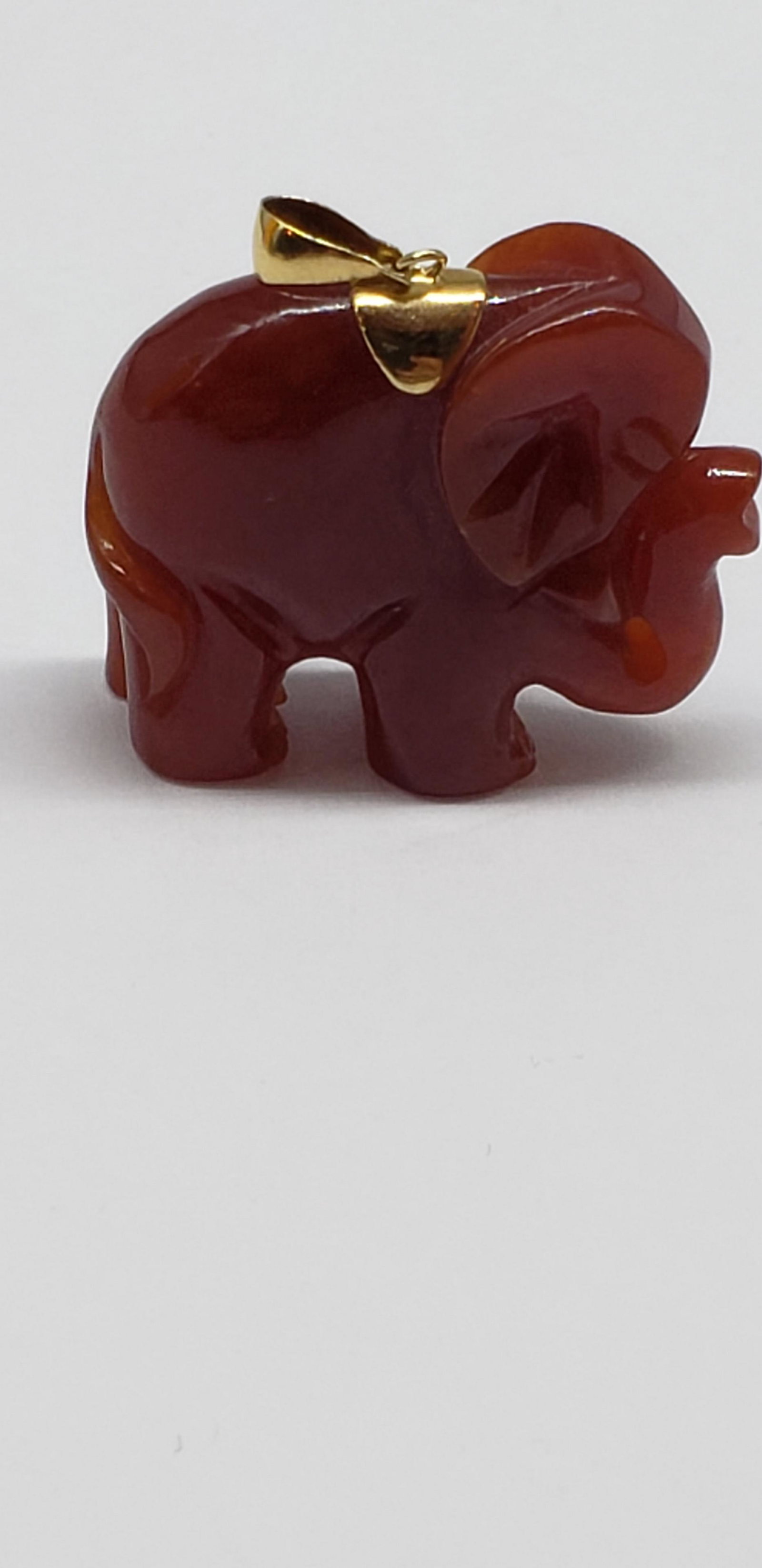 AMBER 14K GOLD ELEPHANT PENDANT: Amber 14K Gold Elephant Pendant Piece is 1 1/3" x 1 1/3" All items Located in in Hollywood Florida Warehouse For Shipping Call today for quote they have item numbers and Pak Mail is available for all 