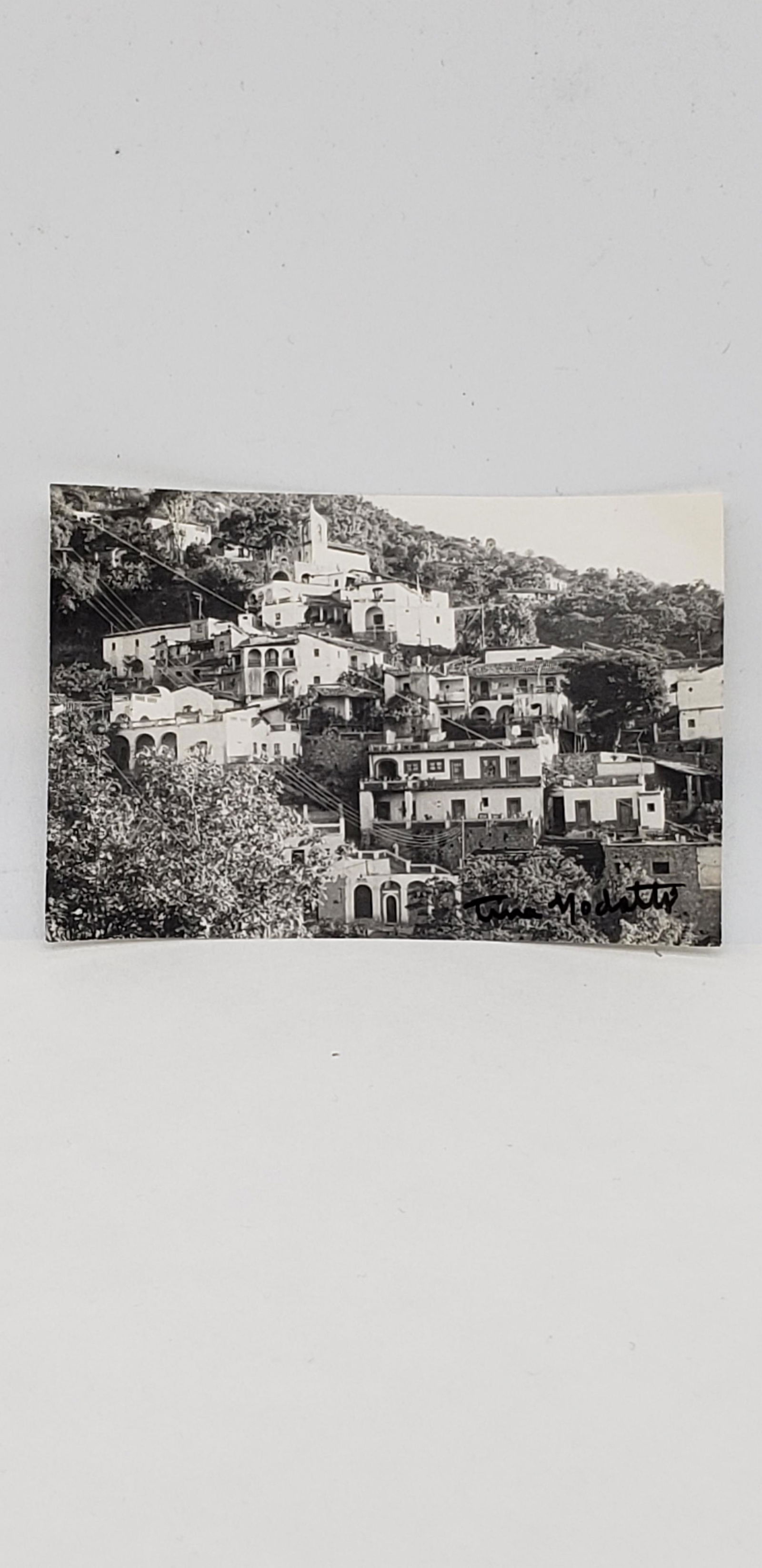 TINA MODOTTI PHOTOGRAPH: TINA MODOTTI PHOTOGRAPH SIGNED AND STUDIO STAMPED 3 1/2" X 2 1/2" Modotti was born Assunta Adelaide Luigia Modotti Mondini in Udine, Friuli, Italy.As a young girl in Italy her uncle, Pietro Modotti, m