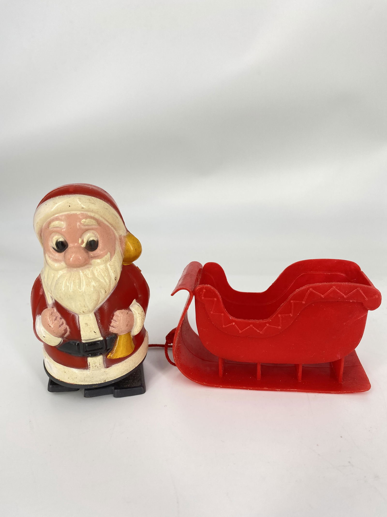 VINTAGE SANTA WIND RAMP WALKER & SLEIGH: VINTAGE SANTA WIND RAMP WALKER & SLEIGH 3" X 2" All items Located in Hollywood Florida Warehouse. Thank you for your inquiry about shipping your precious item/items purchased at Puckett Auctions. Plea