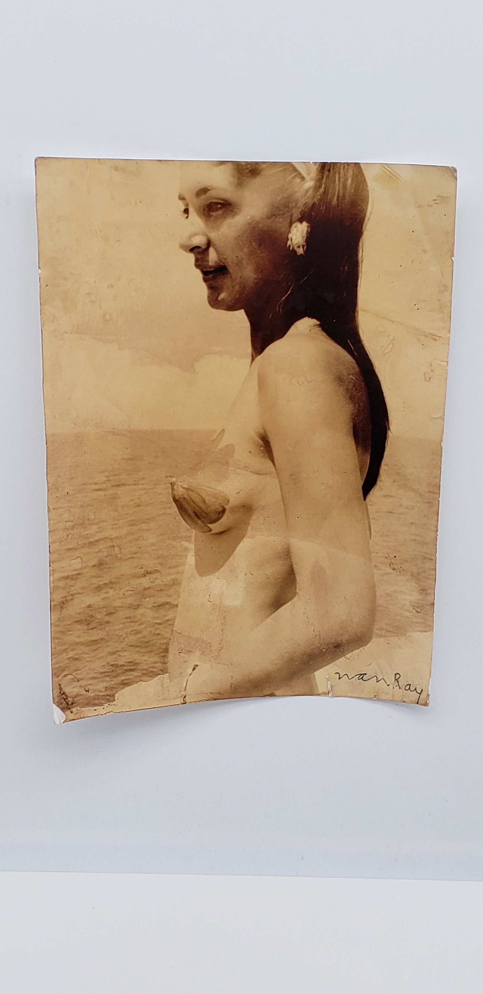 MAN RAY PHOTOGRAPH: MAN RAY PHOTOGRAPH. SIGNED. 7" X 9 1/4"Man Ray (born Emmanuel Radnitzky; August 27, 1890 â€“ November 18, 1976) was an American visual artist who spent most of his career in Paris. He was a signi