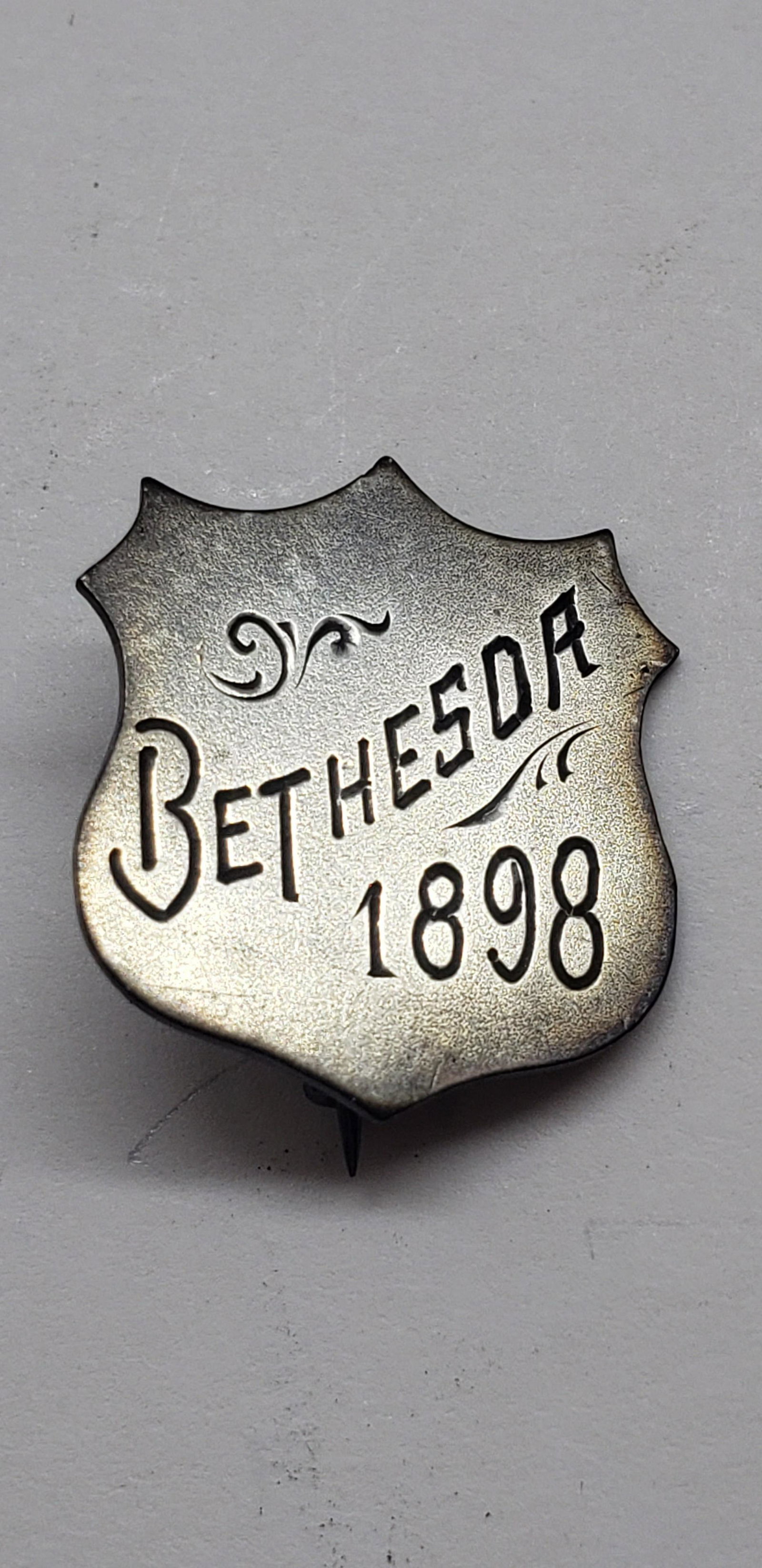 1898 BETHESDA SILVER BADGE: 1898 BETHESDA SILVER BADGE 3/4" X 3/4" All items Located in Hollywood Florida Warehouse. Thank you for your inquiry about shipping your precious item/items purchased at Puckett Auctions. Please note t