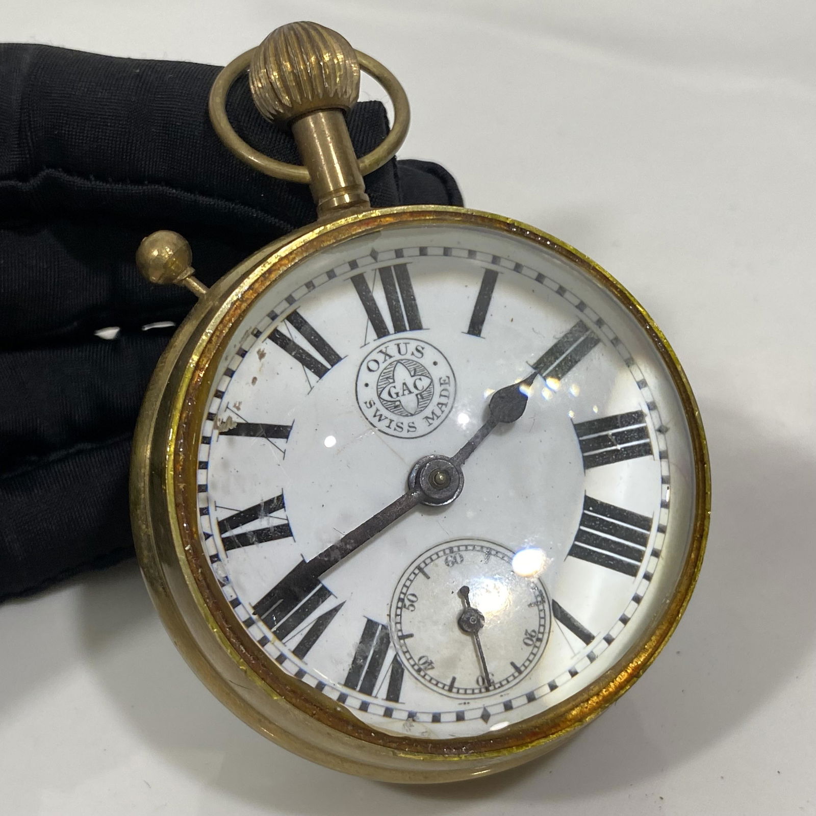 OXUS GAC SWISS MADE BUBBLE GLASS DOME POCKET WATCH DESK CLOCK SKELETON PAPERWEIGHT: OXUS GAC SWISS MADE BUBBLE GLASS DOME POCKET WATCH DESK CLOCK SKELETON PAPERWEIGHT ——WATCH IS NOT WORKING —HAVING SOME ADHEDSIVE RESIDUE SEEN ON THE OUTER EDGES OF THE GLASS - MEASUR