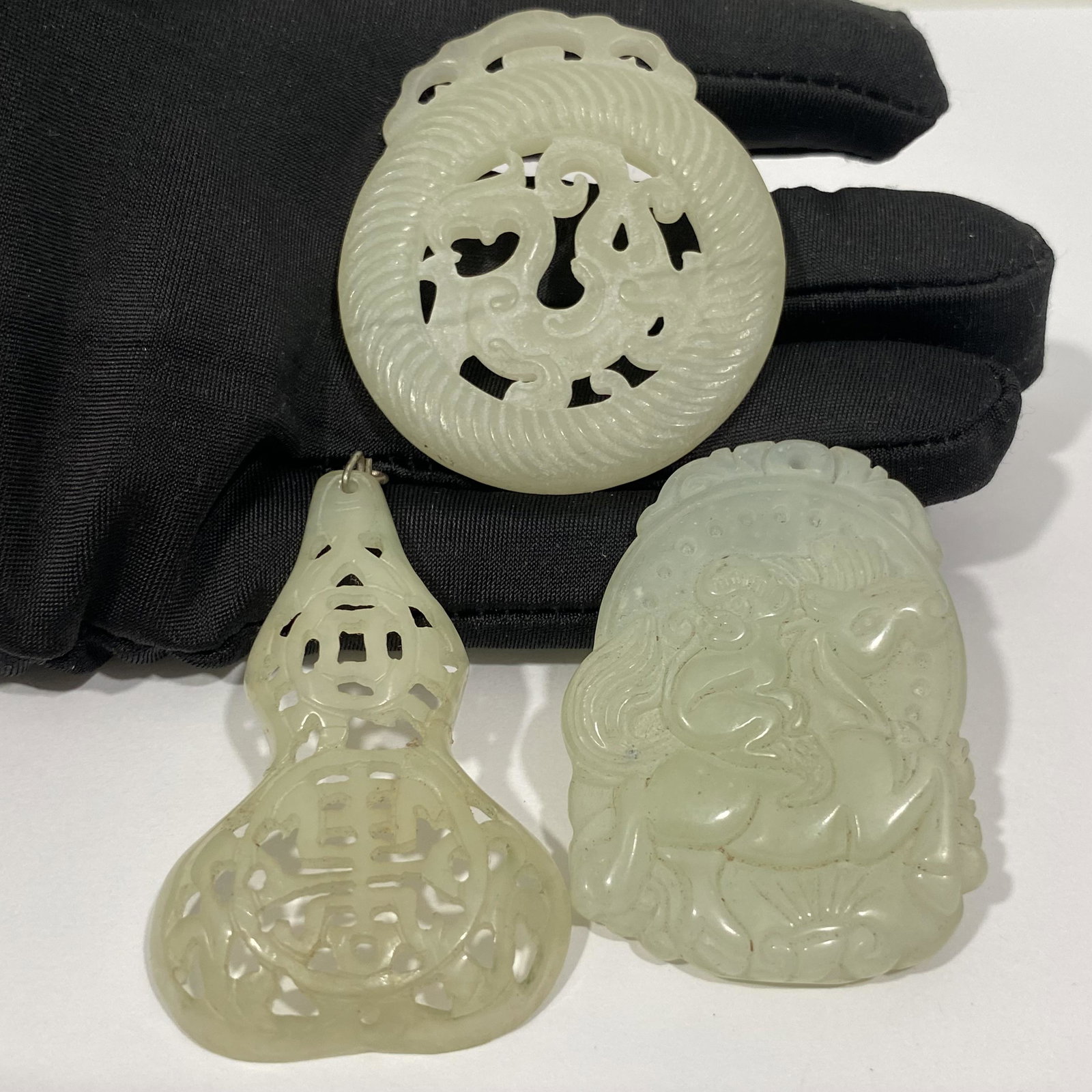 3PC CHINESE CARVED CELADON GREEN JADE PENDANT BI DISC CHARMS: 3PC CHINESE CARVED CELADON GREEN JADE PENDANT BI DISC CHARMS——THE PENDANT SHAPED LIKE A BOTTLE VASE HAS BEEN PREVIOSULY REPAIRED - EACH MEASURES APPROXIMATELY —2"——All it