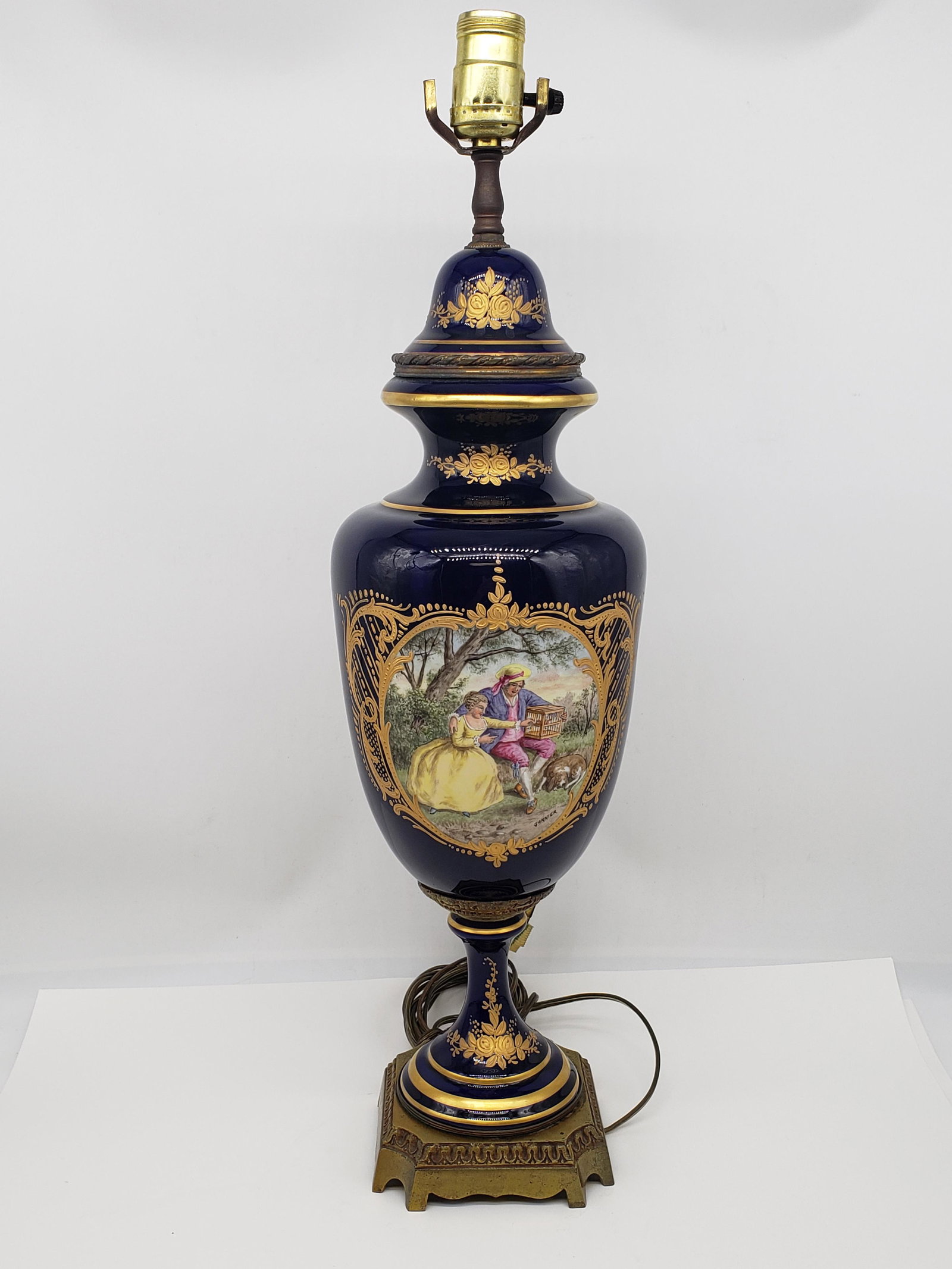 SEVRE URN MOUNTED AS LAMP: SEVRE URN MOUNTED AS LAMP SIGNED RENE MICHEL ON BOTTOM WITH SIGNATURE GARNIER ON LAMP 23" X 7 1/2" All items Located in Hollywood Florida Warehouse. Thank you for your inquiry about shipping your prec