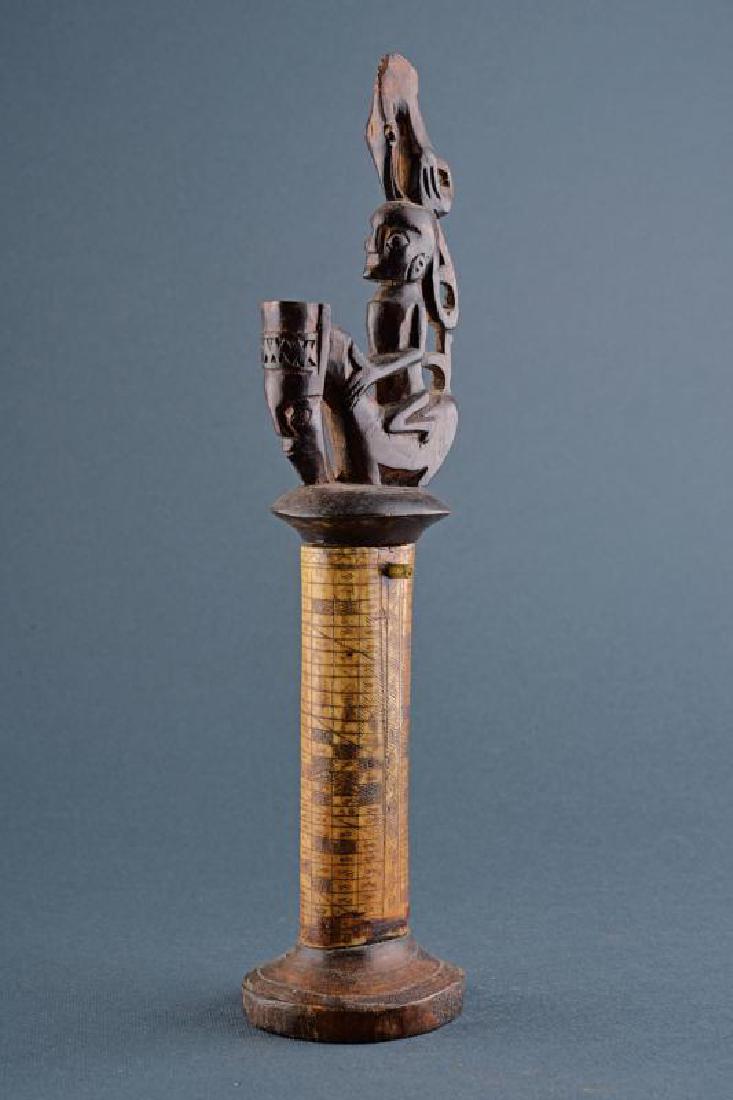 Tolor: dating: First half of the 20th Century provenance: Kalimantan, Bone body of oval section, engraved with geometrical motifs, wooden base shaped as a truncated cone, wooden cover, finely embossed with a