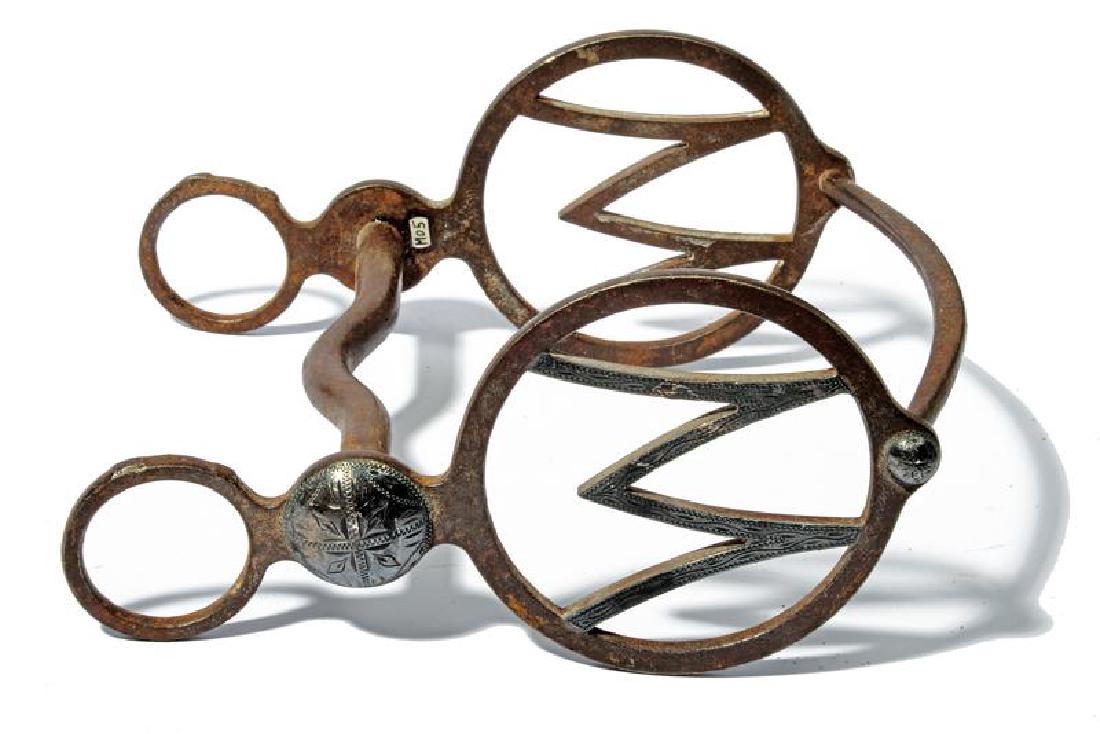 A silver decorated bit (1 of 2)
