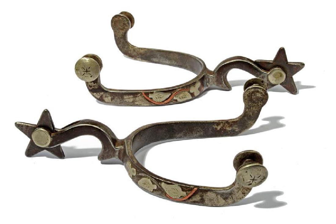 A pair of silver decorated McChesney spurs (1 of 1)