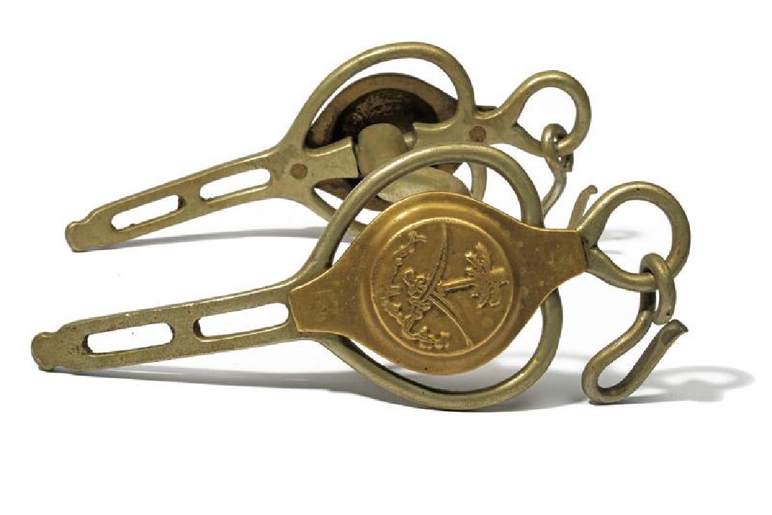 A military bit: dating: Second part of the 20th Century provenance: Arabia, Of English production, with brass side studs with relieved Saudi Arabia emblem. length 18 cm.