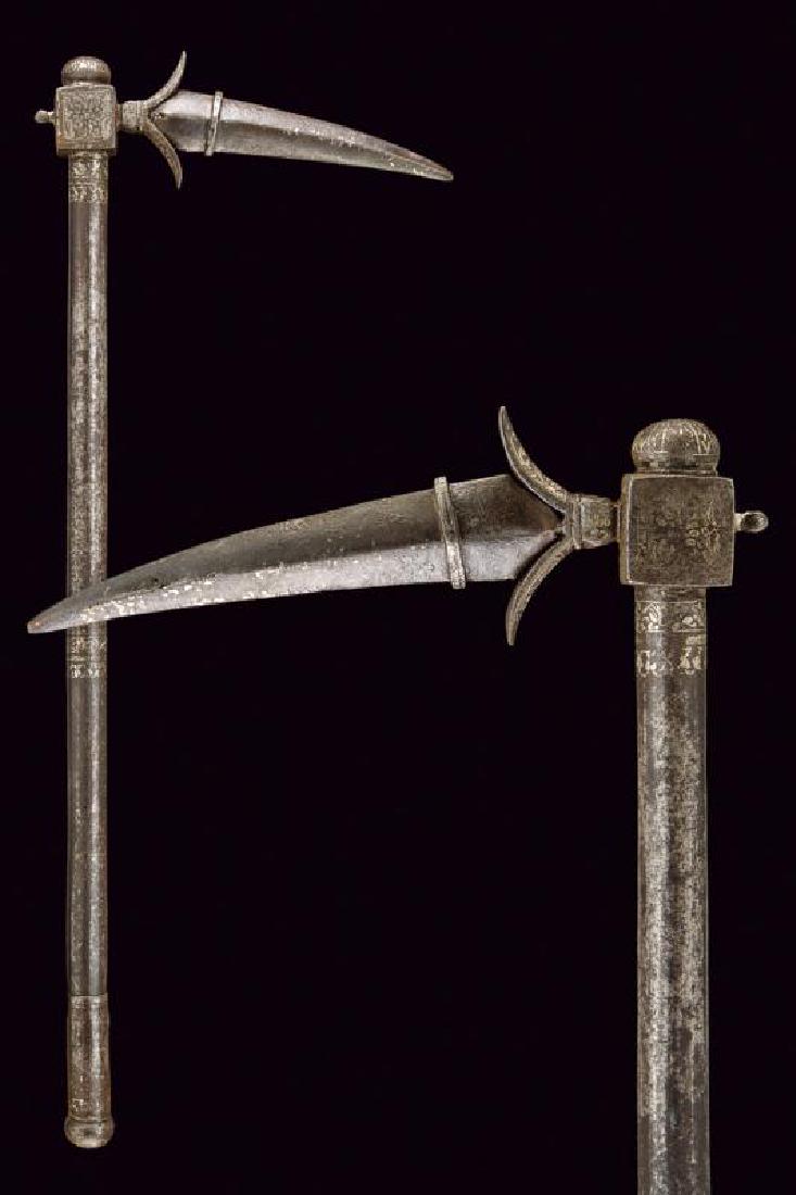 A zaghnal (war hammer): dating: Second half of the 19th Century provenance: India, Beak-shaped blade, strong and grooved, increasing from two petals, provided with iron scabbard. Rectangular quillon block with small, knot-ha