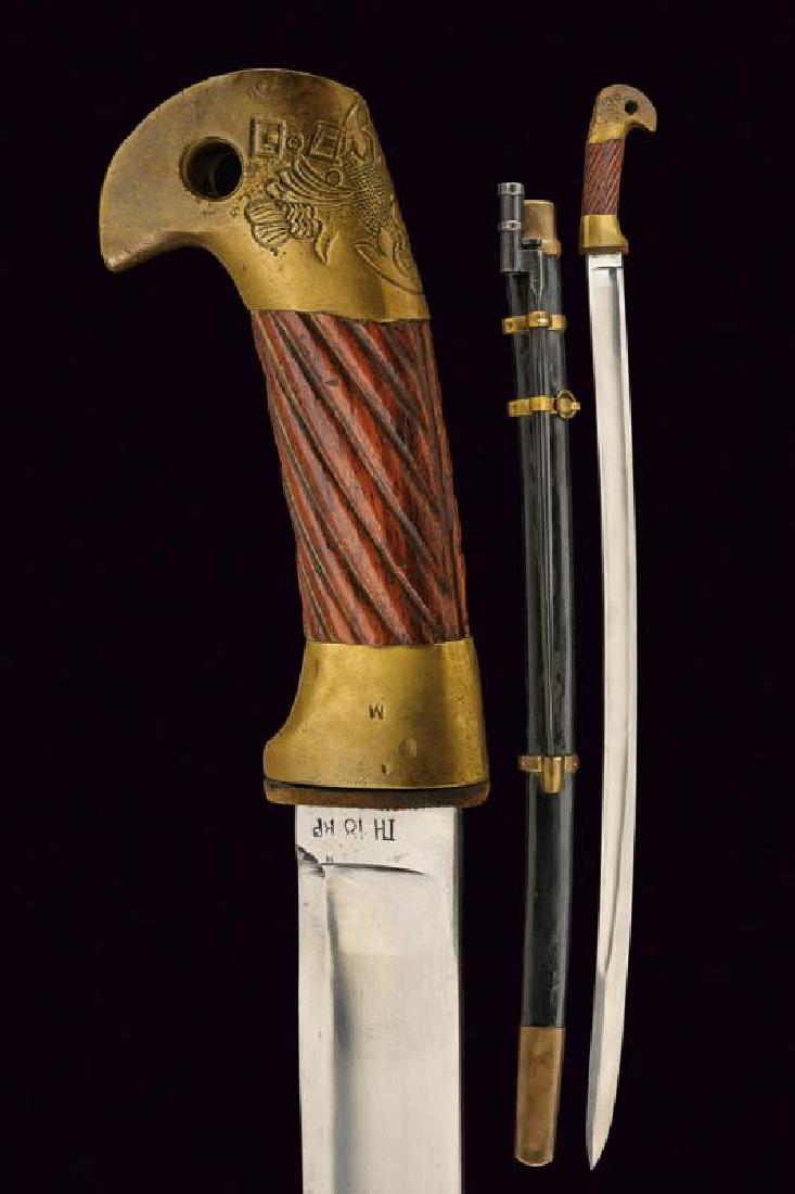 A 1881 model shasqua with bayonet: dating: 1920 provenance: Russia, Curved blade with fuller, date '1920' and various stamps on the tang; brass hilt, marked 'M', pommel marked 'CCCP' and with Soviet symbol, wooden, spiral grip. Wooden 