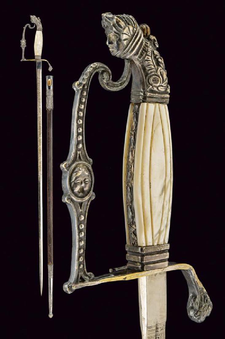 A smallsword for a left handed civil servant: dating: 19th Century provenance: Piedmont, Straight, double-edged blade (later?), ribbed in the center, engraved until the half, with rinceaux, trophies and Savoy emblems, a thin fuller in the center,