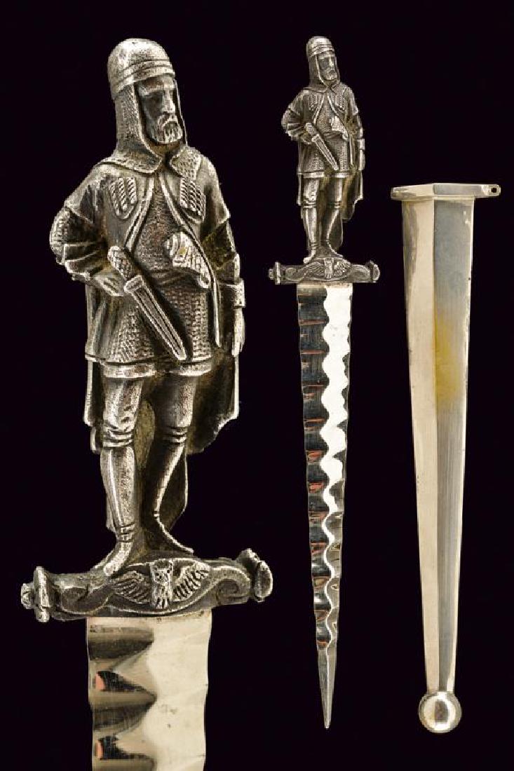 A romantic dagger: dating: 19th Century provenance: Europe, Straight, undulated, double-edged blade with central, undulated raiser. Fine, white metal hilt with in-the-round warrior (a Cossack?) in a mail armor and with 