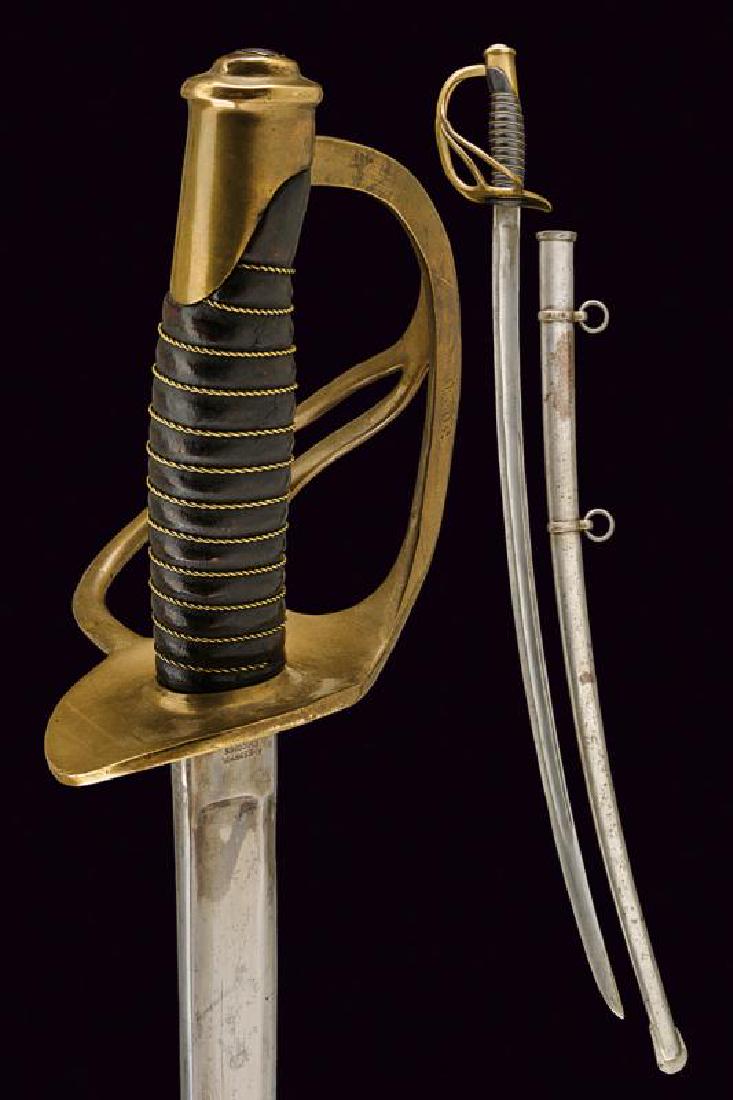 A 1860 model cavalry sabre: dating: Late 19th Century provenance: USA, Curved blade with fuller, marked at the tang; brass hilt with looped guard, grip with leather covering, and wire binding. Iron scabbard with two lugs. Fine,