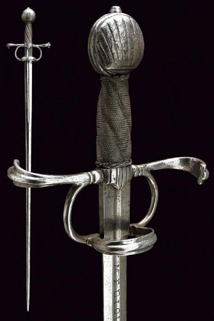 A cavalry sword: dating: 1546 provenance: Italy, Straight, double-edged blade, ribbed in the center, first part and ricasso with central groove, with inscription 'MEDIOLANUM' on one side, and date 'AN 1546' on the oth