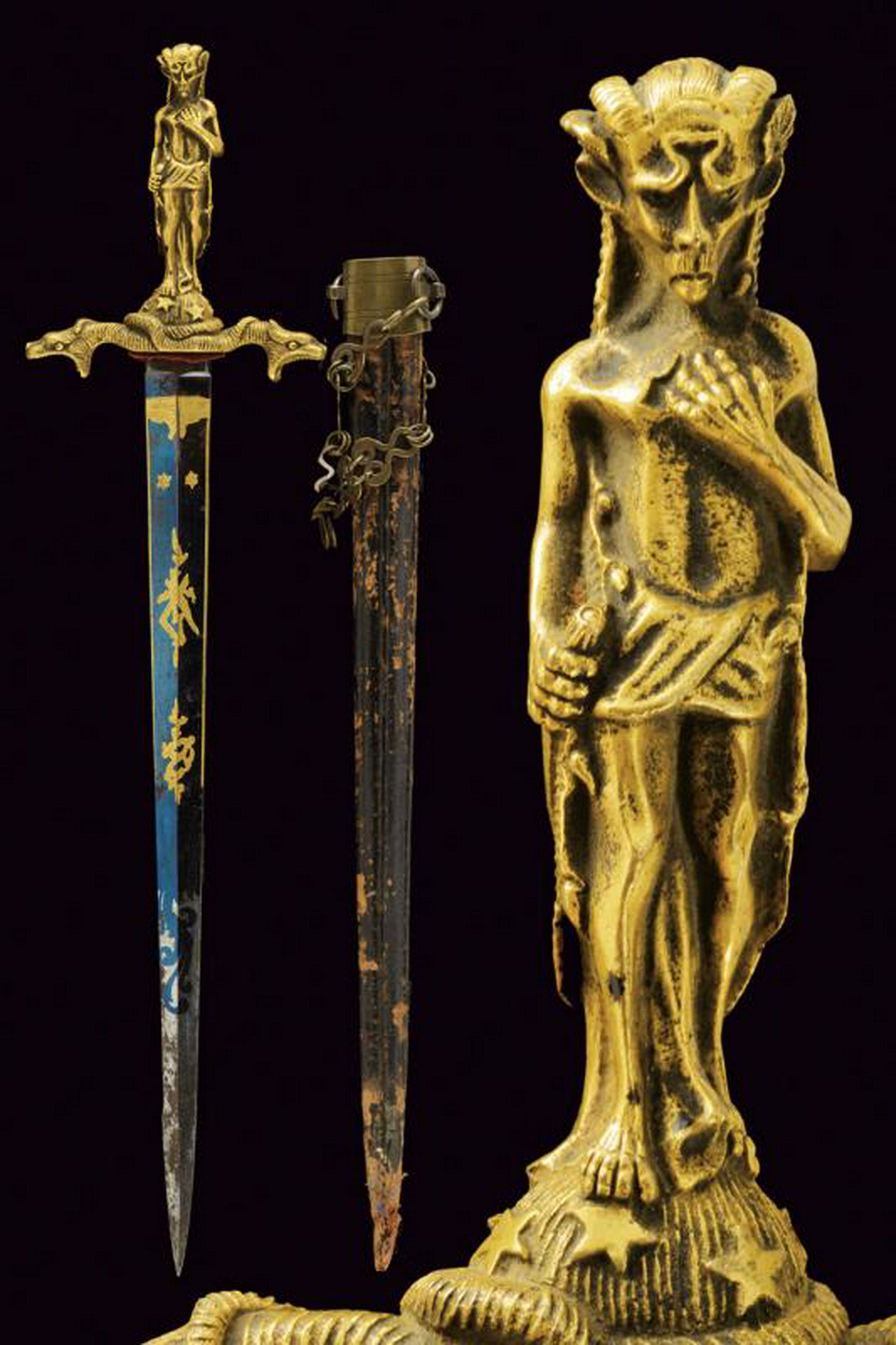 A fine romantic ritual dagger: dating: Mid 19th Century provenance: Europe, Fine, straight, double-edged blade, ribbed in the center, engraved and gilded on a blue ground with trophies and floral motifs, marked at the base 'P. Marz