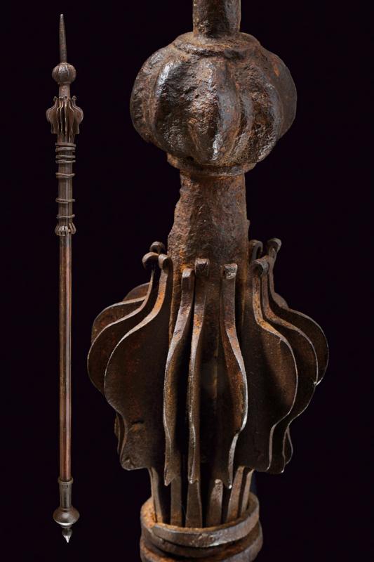 A mace: dating: 17th Century provenance: India, Head composed of fifteen, iron scales, held together by the rings, sphere cusp, flattened and grooved with tip of round section. Wooden haft with iron base. Unu