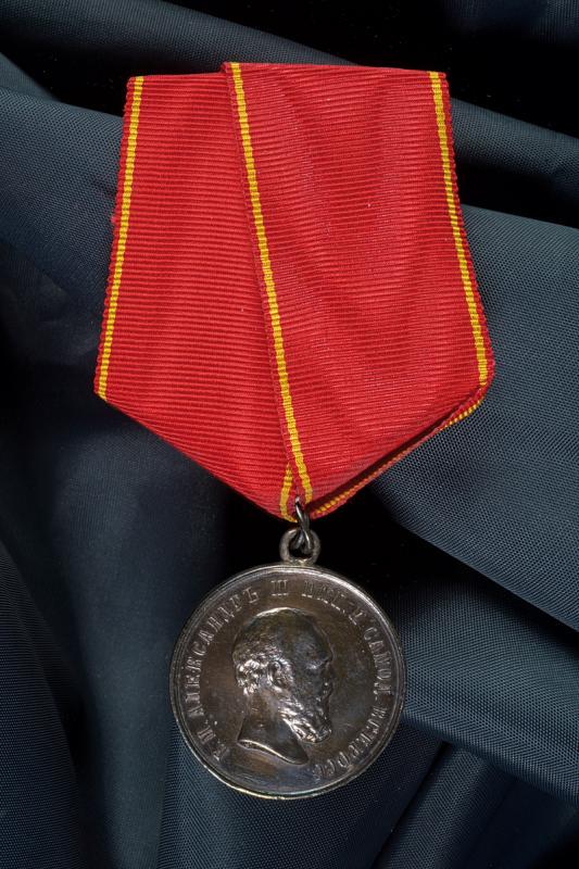 Silver medal for Zeal: dating: Second half of the 19th Century provenance: Russian Empire, Alexander III period. On a ribbon. diameter 2.9 cm.