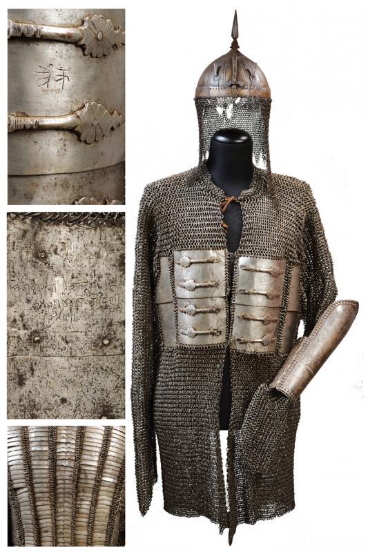 An interesting armour with plates and rings and: dating: late 17th Century provenance: India, Kulha-khud with thick, hammered skull, hemispherical, adorned with raisers outside, surmounted with a cusp, provided with sliding nose-piece and two plume-