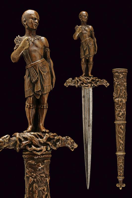 A fine romantic dagger with sculpted archer: dating: Third quarter of the 19th Century provenance: Europe, Straight, double-edged blade, ribbed in the center and with double central fuller in the first half. Fine, bronze hilt with quillon, quill