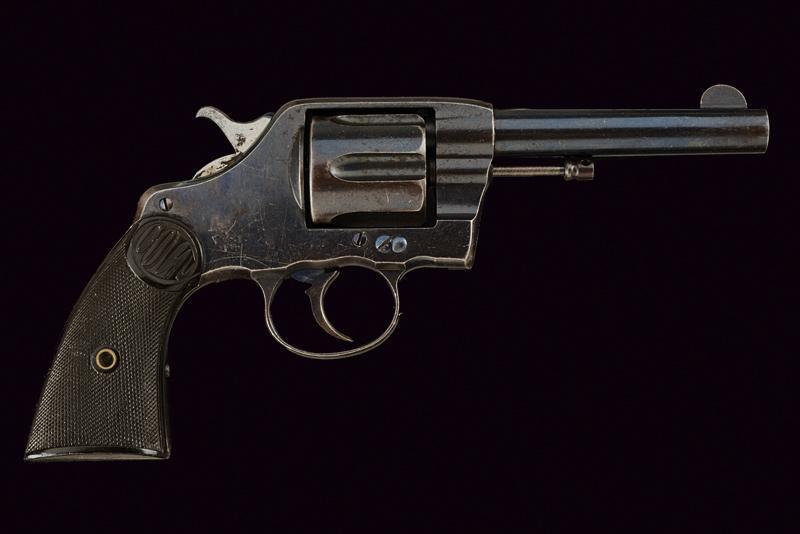 A Colt Model 1889 Navy Double Action Revolver: dating: 1889 provenance: USA, Round, rifled, cal. 41 Colt barrel for 4-1/2', with fore-sight, company's address marking in two lines and third line with patents of 1884 and 1888; caption 'COLT D.A. 41