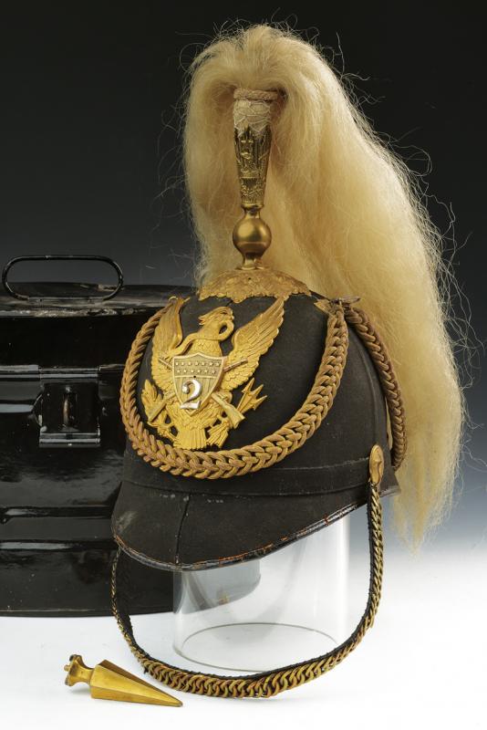 A Mounted Infantry Staff Officer's M1881 Helmet: dating: Late 19th Century provenance: USA, Semi-rigid skull, with grey-black cloth. Big coat of arms at the back depicting an eagle on a shield marked with '2'. Brass mounts. Buttons with crossed rifl