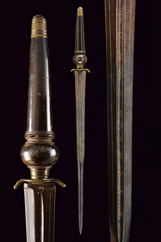 A plug in bayonet: dating: Second half of the 18th Century provenance: North Italy, Straight, colichemarde, double-edged blade, six-sided, deep groove at the first part signed 'TOMASO AYALA' and 'EN TOLELDO'. Brass quil