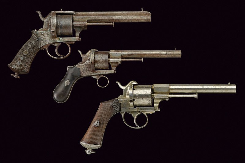 A lot of three pin-fire revolvers: dating: third quarter of the 19th Century provenance: Belgium One with round, 11 mm cal. barrel with foresight; five-shot cylinder with stamps of Liège test bench, the mark "ROCOUR", frame with extra