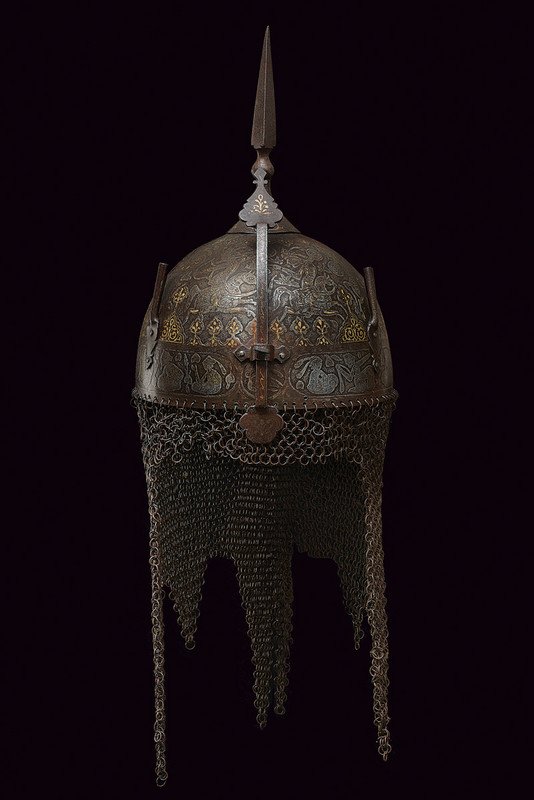 A fine khula-khud: dating: mid-19th Century provenance: Indopersia Hemispherical, iron skull, surmounted by a cusp of square section with knot and circular base; at the front the sliding nose-piece and two plume-holders