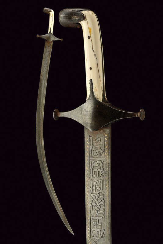 A shamshir: dating: circa 1800 provenance: Persia Curved, single-edged, damask blade with central fuller and small, rear grooves, at the base inscriptions and marks in Arabic, featuring gold decorations; iron hil