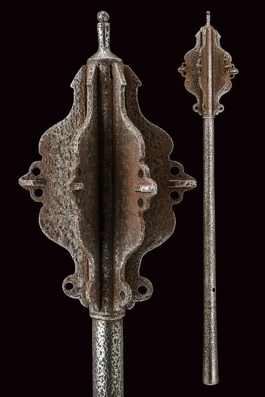 A war mace: dating: 16th Century provenance: Germany Six-flange, iron head, strengthened at the ends, at the top a cylindrical tip; round body, thickening toward the grip, provided with open-work at the base. Rus