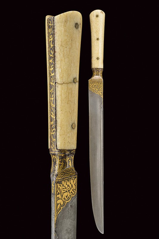 A kard: dating: mid-19th Century provenance: Indopersia Straight, damask blade, featuring a damask groove at the back, the base with gilt, floral decorations; iron hilt decorated en suite and featuring walrus