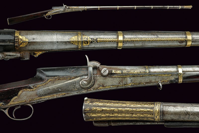 An elegant torador converted to percussion: dating: circa 1800 provenance: India Beautiful, smooth, round, 13 mm cal. barrel, rib with two thin grooves, engraved and gilt with floral motifs, the base with chiselled rear-sight, bell-mouthed nozz