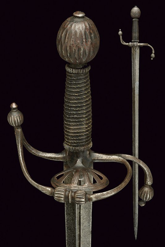 A rapier: dating: late 16th Century provenance: Italy Straight, double-edged blade (pitting), ribbed at the centre and provided with a thin fuller at the forte decorated with a series of short, engraved segment