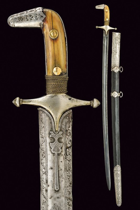 A silver mounted sword: dating: 19th Century provenance: Arabia Slightly curved, single-and false-edged blade with wide fuller, the tip of lenticular section; tang; silver hilt with cross-shaped quillon, angled, engraved cap