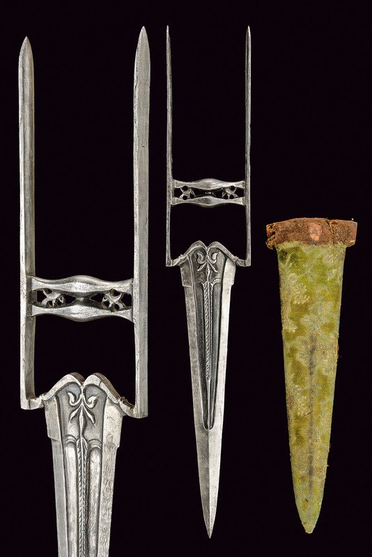 A katar: dating: 19th Century provenance: India Triangular, damask blade with grooves and cannelure at the center; typical, damask hilt with two, partially pierced crossbars. Wooden scabbard with velvet coveri