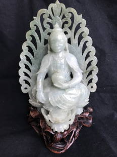 Jade Buddha, c.1970: Jade Buddha, c.1970. Height:6.5"(with stand), width:4.5".