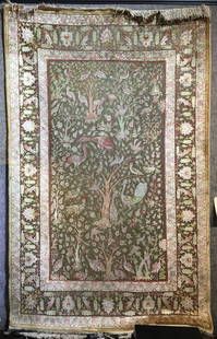 Handmade silk rug, 47” x 76”.Circa 1965.: Handmade silk and metallic thread rug, 47” x 76”.Circa 1965.Rug experts who have examined this piece have said it is a hand made Hereke, Turkish carpet.