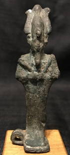 Egyptian bronze Shabti on wood stand: Egyptian bronze Shabti on wood stand.Egyptian period.3.25"high(figure), 1.25"(wood base).