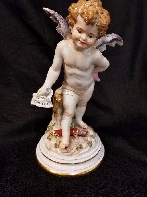 Meissen Angel with shoe and contract, c.1900: Meissen Angel with shoe and contract, c.1900. 6"x 11.5".Estate of Leo and Anita Jaffe, NYC.Leo Jaffe was the Chairman of Columbia Motion Picture Studios for 20 years, from the 1960’s through the 197