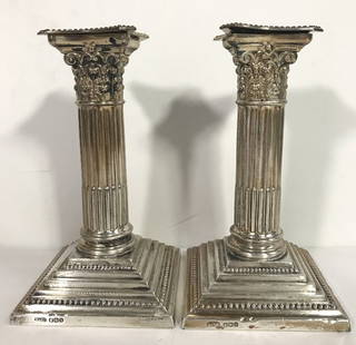 Tiffany & Co sterling column candlesticks, d.1966: Pair of Tiffany & Co sterling silver column candlesticks, dated 1966. 3.25"x 5.75" each.Weighted.Small dents to the widest edge of the base.Hallmarked English sterling and "T & Co" on both, along with