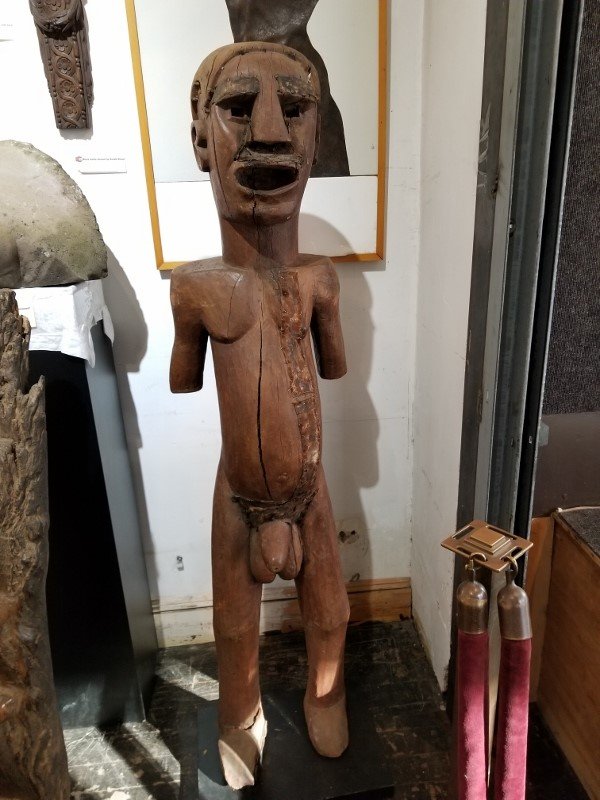 Tanzanian life sized wood figure, Allan Stone Prov: Tanzanian life sized wood figure, Allan Stone Prov. Figure: 13.5"x 63" base: 13.75"x 18.5"x 1.5".From the Estate of Tim Hunt, Andy Warhol friend and sometimes business partner,who owned and operated H