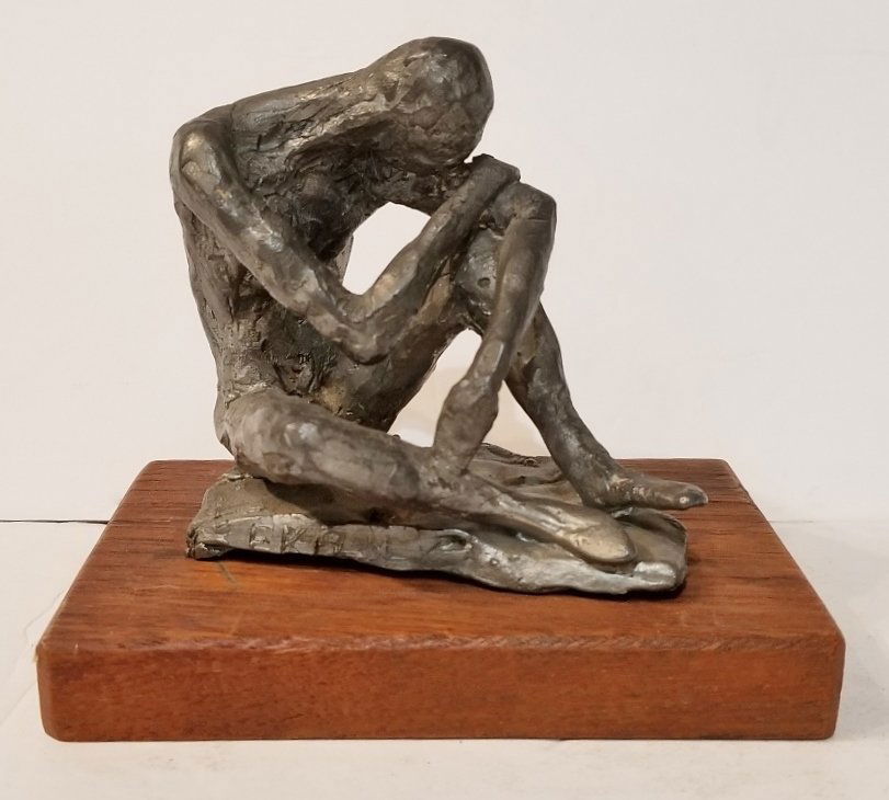 Statue of figure signed "EK 1968" (1 of 6)