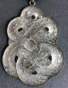 Glass serpent pendant in silver, attributed to Lalique: Glass serpent pendant mounted in silver, attributed to Lalique. From the Estate of Leo Kaplan, internationally recognized glass dealer in NYC for over 40 years. 1.75"x 2.25".