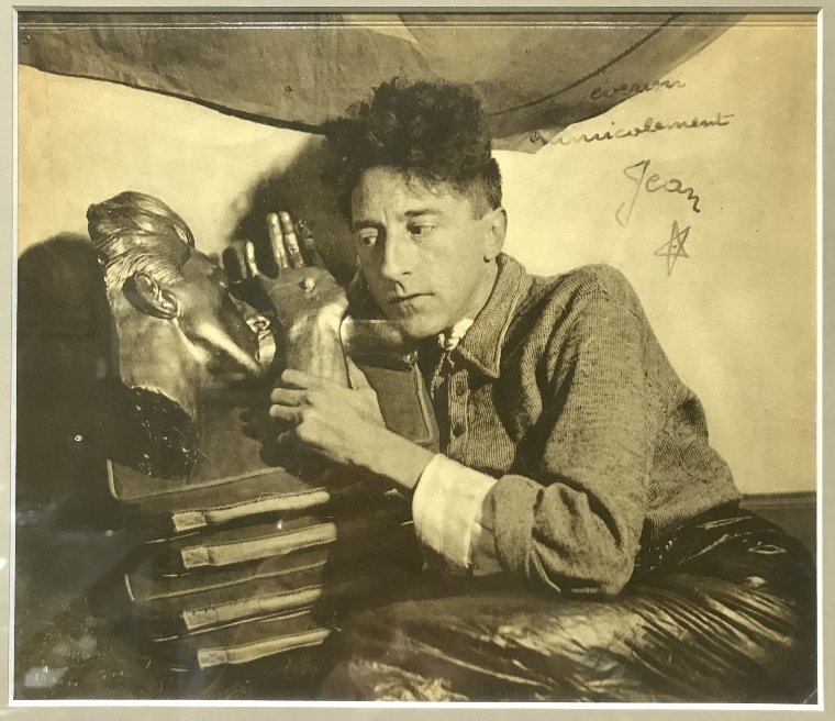 Photo, Jean Cocteau w/mask by J.Roubier, inscrib 1935: Photo of Jean Cocteau with mask by Jean Roubier, inscribed by Cocteau. Dimensions with frame H 14.75", W 16", picture H 8", W 9".An orignal photo from the famous series Roubier did of Jean Cocteau, wh