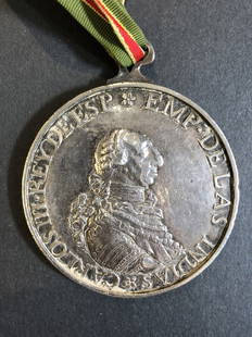 Important Carlos III large size Peace Medal, 18th cen: Known as the Tomas Pieto Il Merito Spanish Peace medal, this large size(2 and 3/4"wide)solid sterling silver medal showing Carlos III, (6 troy oz total) was given to the American Indians in the 18th c