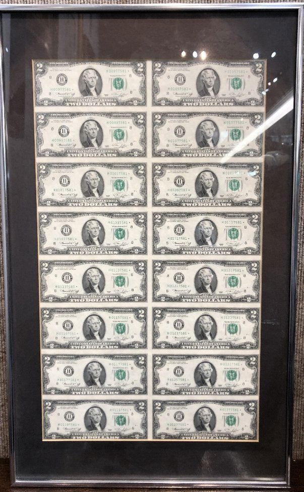 One uncut sheet of two dollar bills: One uncut sheet of two dollar bills, issued by the US Treasury. Bills: 12"x 20.5" in a frame: 15.5"x 26".