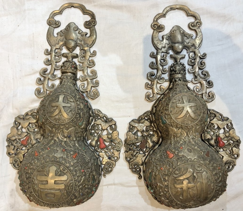 Pair of Mongolian wall decorations, inlaid stones: Pair of Mongolian wall decorations, inlaid stones. 15" long each.