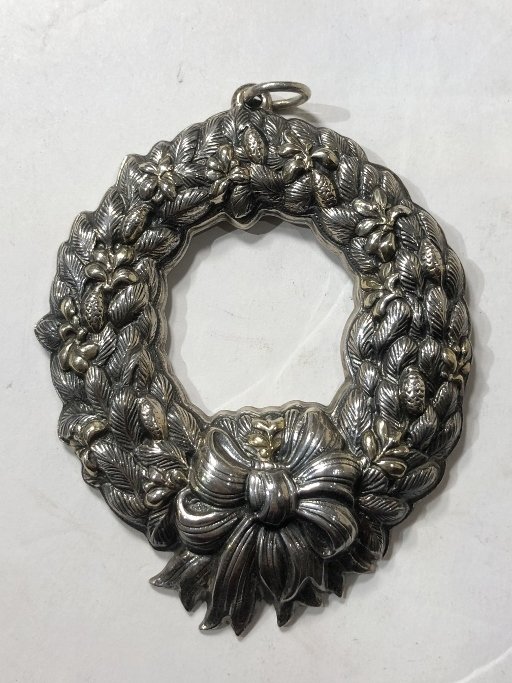 Buccellati sterling Xmas ornament(wreath), 2.3 t.oz: Buccellati sterling Xmas ornament(wreath). Weight 2.3 t.oz. Measures 4 in. X 3 in.