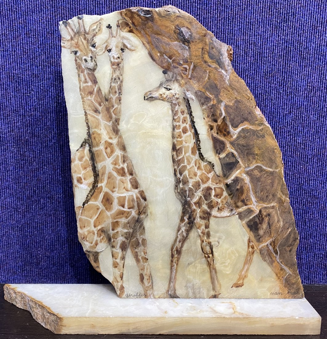 Stone sculptures of giraffes by Nan Lee: Stone sculptures of giraffes by Nan Lee.This sculpture measures 17 inches by 16 inches by 3.5 inches.